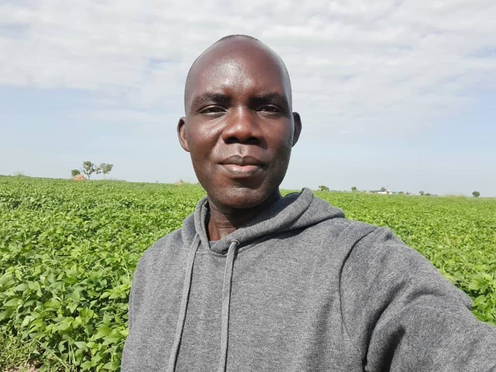 A cultivated field under an open sky in northern Uganda